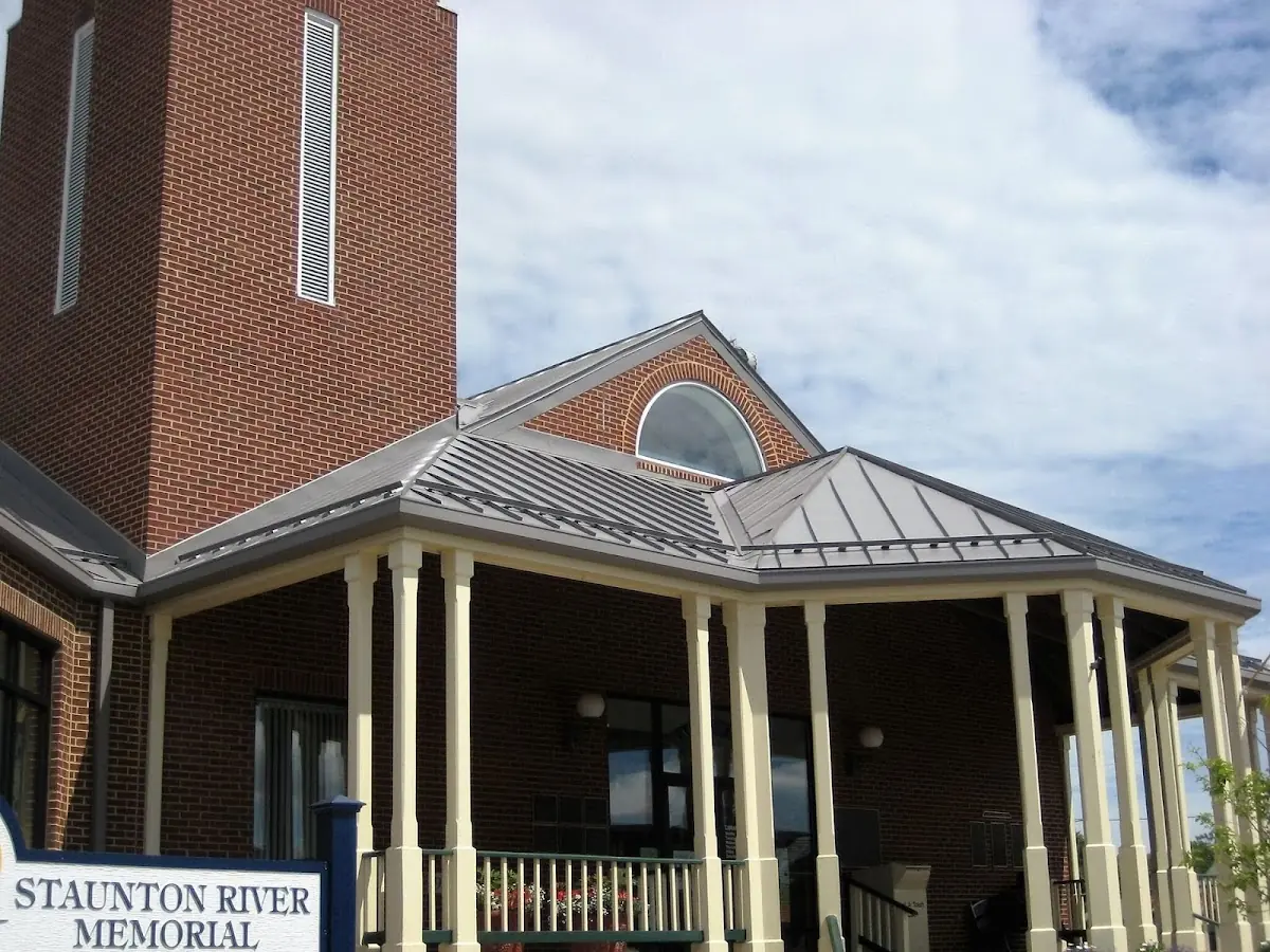 Skilled roofing craftsmen working on a residential roof in Fort Wayne